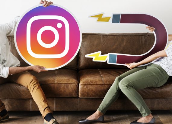 People holding an Instagram icon